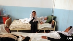 Hospitalized schoolgirls with symptoms of poisoning in Charikar, the second of three recent similar incidents.