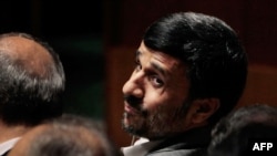 Iranian President Mahmud Ahmadinejad looks back before addressing the Nuclear Nonproliferation Treaty (NPT) Review Conference in New York today.