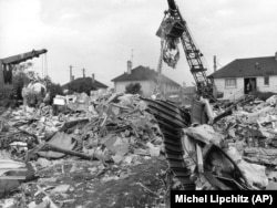 Part of the fuselage of the Tu-144 lies in foreground amid ruins of houses of the village of Goussainville destroyed by debris from the plane crash in 1973.