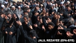 Afghan Shi'a flagellate themselves with chains during a mourning procession commemorating Ashura in Herat on September 20.