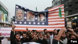 Pro-government demonstrators rally in Tehran on December 30.