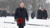 Russian President Vladimir Putin lays flowers during a ceremony to mark the 75th anniversary of the Soviet breakthrough in the Nazi Siege of Leningrad in World War II, in St. Petersburg on January 18. 