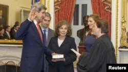 John Kerry (left) is officially sworn in as secretary of state in Washington on February 1. 