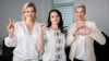 Using gestures that would later become iconic opposition symbols, Svatlana Tsikhanouskaya clenches her fist, Maryya Kalesnikava makes a heart sign, and Veranika Tsapkala signals V for victory while campaigning ahead of Belarus's disputed presidential election in 2020. 