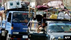 Internally displaced Pakistani residents fleeing military operations against Taliban insurgents in the country's North Waziristan tribal area arrive in the town of Bannu earlier this year.