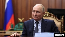 Russian President Vladimir Putin attends a meeting in Moscow on November 27.