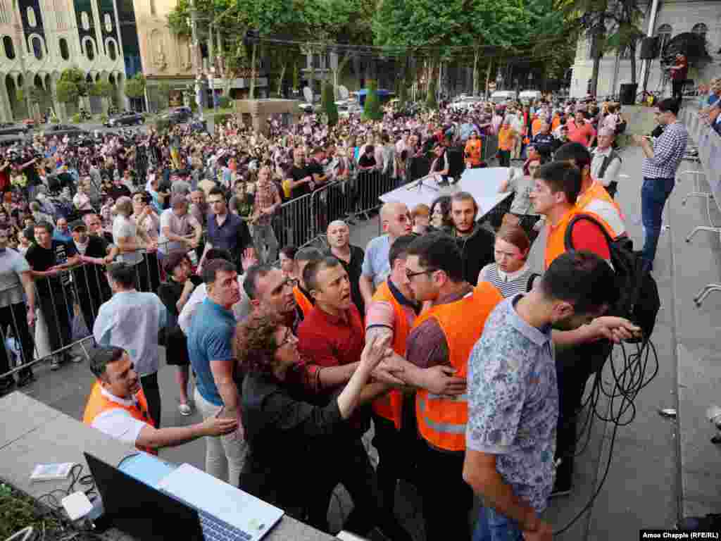 Arguments broke out while opposition politicians apparently tried to gain access the stage and address the protesters. The appearance by Gavrilov in parliament on June 20 drew strong reactions from opposition members, student activists, and others as thousands turned out to demonstrate.&nbsp;Georgia&#39;s parliamentary speaker, Irakli Kobakhidze, resigned after the incident.