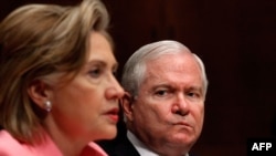 U.S. Secretary of State Hillary Clinton (left) testifies before the Senate Foreign Relations Committee with Defense Secretary Robert Gates about the new START treaty.