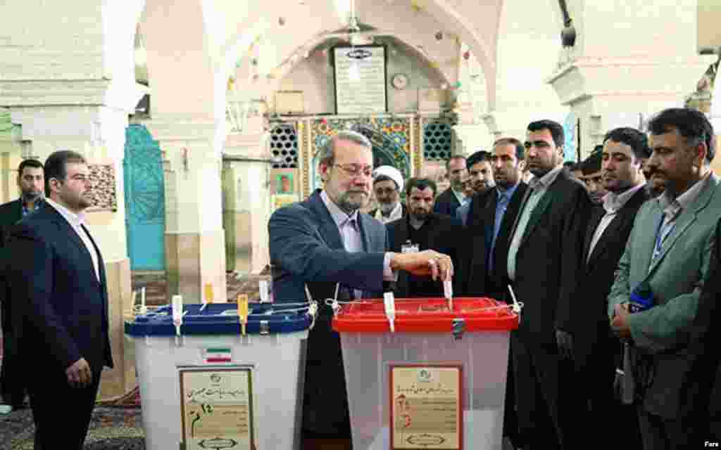 Ali Larijani casts his ballot in Tehran.