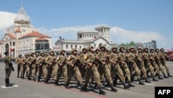 Soldiers from Azerbaijan's breakaway territory of Nagorno-Karabakh march in Stepanakert. Both Yerevan and Nagorno-Karabakh's self-declared, internationally unrecognized leadership maintain that the separatist forces solely comprise ethnic Armenian fighters from the breakaway region.