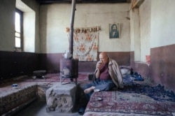 A 2016 photo by Solmaz Daryani shows an elderly man in a teahouse on the edge of Lake Urmia.