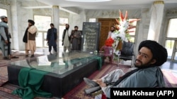 Taliban fighters at the tomb of late Afghan muhajedin leader Ahmad Shah Massoud in Panjshir Province on September 15, days after the militants repaired the site following public outrage over its desecration.