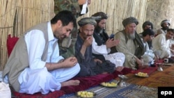 Asadullah Khalid (left) meets with journalists and local elders during his time as governor of Kandahar Province in 2008.