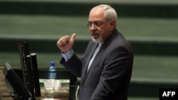 Foreign Minister Mohammad Javad Zarif addresses the parliament in Tehran on November 27.