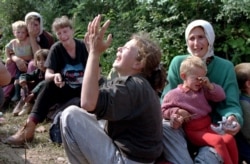 Srebrenica refugees weep over the loss of their men in Tuzla in July 1995 after they were evacuated from Potocari.