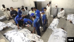 Bodies of victims of the ethnic clashes at a mortuary of a local hospital in Karachi