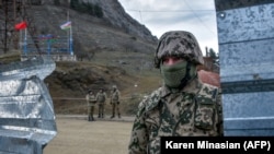 Azerbaijani soldiers on patrol at a checkpoint in the disputed Nagorno-Karabakh region. (file photo)