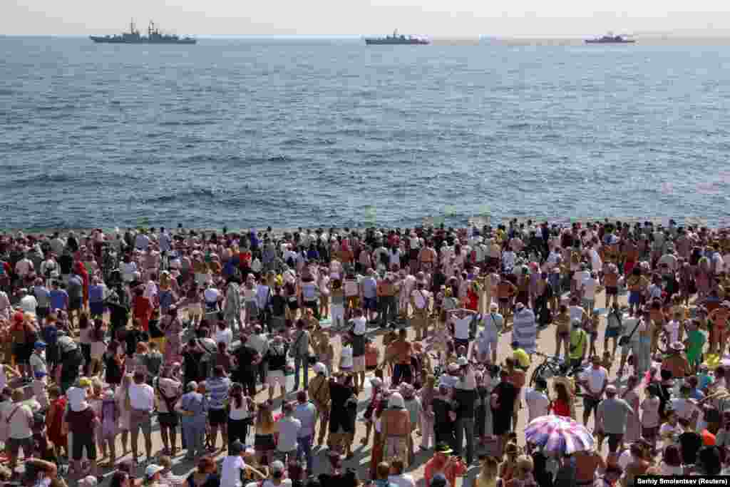 Spectators attend the Independence Day military parade in Odesa.