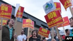 Local residents demonstrate in Saint-Hyacinthe, Canada, before a public meeting called by the shale-gas industry in September 2010.