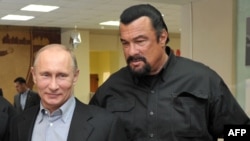 Russian President Vladimir Putin (left) with American movie actor Steven Seagal, who has just been named as a "special representative" for Russian-U.S. cultural links. (file photo)