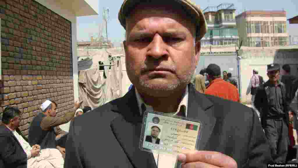 Kabul resident Zulgai gets his first voting card.