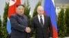 Russian President Vladimir Putin (right) and North Korean leader Kim Jong Un shake hands during a meeting in Vladivostok, Russia, in April 2019.