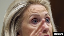 U.S. Secretary of State Hillary Clinton gestures during a hearing of the House Foreign Affairs Committee today.