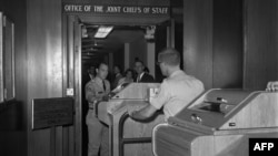 Employees install equipment for the hotline in the White House in August 1963.