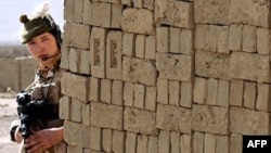 A British soldier patrols on the outskirts of Kabul.