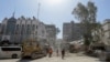 Rescue workers search the rubble of a building annexed to the Iranian Embassy a day after an air strike in Damascus on April 2.