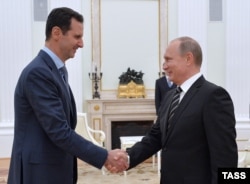 A file photo of Russian President Vladimir Putin and his Syrian counterpart Bashar al-Assad.