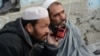 Afghan men listen to a radio in Jalalabad. (file photo)