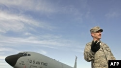 A U.S. officer on the runway at the Manas air base