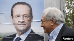 Former IMF head Dominique Strauss-Kahn arrives at a polling station in the first round of the 2012 French presidential election in Sarcelles on April 22.