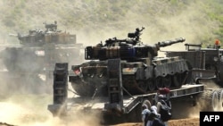 Army vehicles being used in the operation against the Taliban just outside the Buner district on April 29