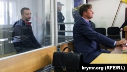 Russian citizen Maksim Odintsov (left) in a Kyiv court in 2017