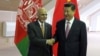 Afghan President Ashraf Ghani (left) meets with Chinese President Xi Jinping.