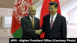 Afghan President Ashraf Ghani (left) meets with Chinese President Xi Jinping.