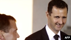 Syrian President Bashar al-Assad (right) and his Russian counterpart, Dmitry Medvedev