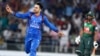 Rashid Khan (left) celebrates the wicket during the first Twenty20 International cricket match between Afghanistan and Bangladesh at Rajiv Ghandi International Cricket Stadium in Dehradun on June 3. 