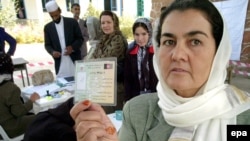 Afghans have begun registering for the August vote.