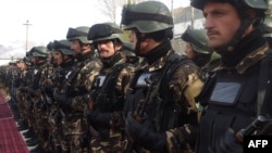 Afghan security forces stand during a ceremony to hand over security control in Badakhshan province, Faisabad, in January 2012.