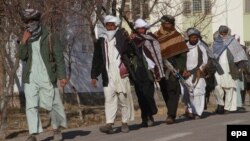 Taliban militants surrender at an amnesty ceremony in Herat, in western Afghanistan, in January 2012.