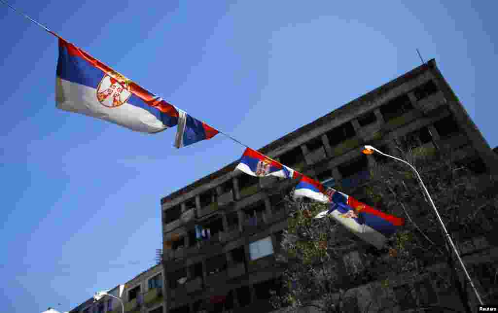 Serbian flags fly on the north side of town.