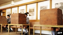 German voters in traditional Bavarian garb in Bayrischzell on September 27.