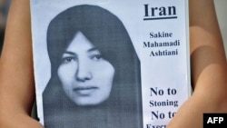 A placard showing Sakineh Mohammadi Ashtiani during a protest in London against her execution