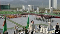 Turkmen President Gurbanguly Berdymukhamedov heads into the new palace at its unveiling ceremony in Ashgabat on May 18.