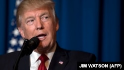 U.S. President Donald Trump delivers a statement late on July 6 in Florida announcing missile strikes against Syria in retaliation for a suspected chemical-weapons attack by regime forces.