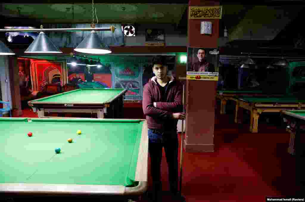 Farzad Aslami, 18, at a snooker club in Kabul. &quot;We want peace for the sake of our country&#39;s welfare. We don&#39;t want any more suicide attacks and explosions.&quot;