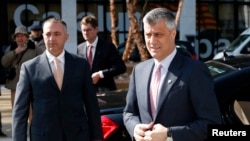 Kosovar Prime Minister Hashim Thaci (right) arrives for the talks in Brussels on April 2.